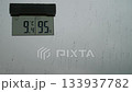 Cloudy weather outside. Rainy weather outside. A thermometer and raindrops on the windowpane. Raindrops on the glass. Cloudy weather outside. Rainy weather outside. A thermometer and raindrops on the windowpane. Raindrops on the glass. 133937782