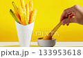 Crunchy Pickles In Bold Yellow Scene Being Dipped In Cheese Sauce. Great For Snack Ads, Bold Food Branding, Trendy Packaging, And Modern Fast-Food Inspired Social Media Content 133953618