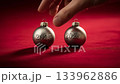 Sparkling Resolutions: New Year Ornaments Displaying 2025 and 2026 on Vibrant Red Backdrop 133962886