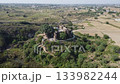 Sangni Fort aerial view shows historic site beside quiet village 133982244