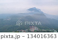 Morning fog rolling over mountain village and tea fields in Alishan, Taiwan. 134016363