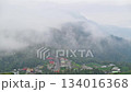 Morning fog rolls over a mountain village in Alishan, Zhuxi Township, Taiwan. 134016368