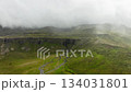 Clouds Above Green Hills, Mountain Range in Iceland Aerial View 134031801
