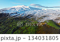 Highlands in Iceland, Mountain covered with green moss and snow in early spring 134031805