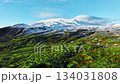 Highlands in Iceland, Mountain covered with green moss and snow in early spring 134031808