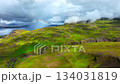Clouds Above Green Hills, Mountain Range in Iceland Aerial View 134031819