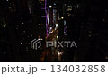 Aerial View Urban City at Night Bright Illuminated with Tall Glass Buildings Hong Kong, Streets, and Busy Atmosphere. Asian City from Above Glimmers at Night. Steel Structure Chinese 4k 134032858