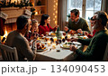 A large friendly family celebrates Christmas at the festive table. 134090453