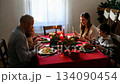 A large friendly family celebrates Christmas at the festive table. 134090454