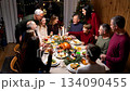 A large friendly family celebrates Christmas at the festive table. 134090455