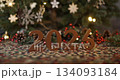 wooden number 2026 on Christmas shiny festive background with fir brench tree and toy balls. 134093184