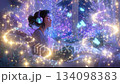Listening to music at night while surrounded by glowing butterflies in a cozy bedroom 134098383