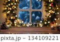 Cozy Winter Scene with Snowy Window, Evergreen Decor and Lights 134109221