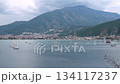 Aerial view of Fethiye marina and harbor in Turkey with numerous yachts, sailboats, and gulet boats anchored in bay with mountains 134117237