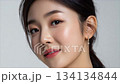 a beautiful korean woman poses for the camera 134134844