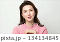 A beautiful Korean woman in her thirties, wearing a sweater_3 134134845