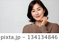 A beautiful Korean woman in her thirties, wearing a sweater_2 134134846