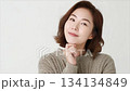A beautiful Korean woman in her thirties, wearing a sweater_5 134134849
