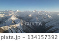 Snow-capped mountain range panorama with gradual zoom out revealing landscape 134157392