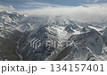 Majestic mountain range panorama with snow-capped peaks, camera pans across 134157401