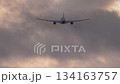Passenger airliner taking off at sunset. 134163757