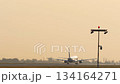 Airliner departure at sunrise 134164271