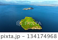 Aerial View of a Green Island in the Blue Ocean 134174968