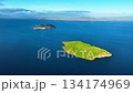 Aerial View of a Green Island in the Blue Ocean 134174969