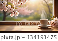 Spring cafe scene with coffee by the window and cherry blossoms (steam, loop video) 134193475