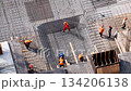 Construction workers installing rebar for building foundation 134206138