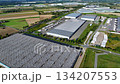 Exploring a modern logistics hub with drone views of warehouses and trucks 134207553