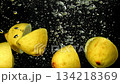 Lemon slices falling under water on a black background. Filmed on a high-speed camera at 1000 fps. High quality FullHD footage 134218369