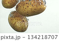 Potatoes falling under water on a white background. Filmed on a high-speed camera at 1000 fps. High quality FullHD footage 134218707