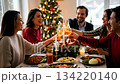 A large friendly family celebrates Christmas at the festive table. 134220140