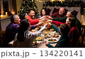 A large friendly family celebrates Christmas at the festive table. 134220141