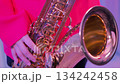 Extreme close-up of a tenor saxophone player 2: Red jacket 134242458