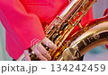 Extreme close-up of a tenor saxophone player 1: Red jacket 134242459