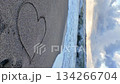 Heart symbol written on the sand 134266704