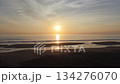 浜から朝日に向かって進む海岸の空撮映像 134276070