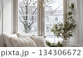 Cozy winter window with fairy lights and snow outside, hygge interior 134306672