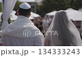 Jewish ceremony under the chuppah, rear view. 134333243