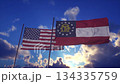 Patriotic Display of USA and Georgia State Flags Against Dramatic Sky 134335759