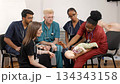 Medical students learning infant cpr training procedures 134343158