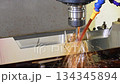 The CNC milling machine cutting the mold parts with oil coolant method. 134345894