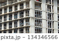 Construction site of unfinished building with concrete frames and glass windows in urban area video Construction site of unfinished building with concrete frames and glass windows in urban area video 134346566
