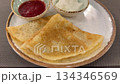 Pancakes with two different sauces on a ceramic plate, served on a woven placemat background video Pancakes with two different sauces on a ceramic plate, served on a woven placemat background video 134346569