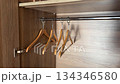 Wooden hangers in an empty closet, suitable as a minimalist background with copy space video Wooden hangers in an empty closet, suitable as a minimalist background with copy space video 134346580