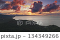 Vibrant sunset illuminating the Pacific Ocean and dramatic sky clouds over lush green coastline of Savusavu, Fiji, creating a serene tropical landscape. Aerial drone flight footage. Nature background Vibrant sunset illuminating the Pacific Ocean and dramatic sky clouds over lush green coastline of Savusavu, Fiji, creating a serene tropical landscape. Aerial drone flight footage. Nature background 134349266