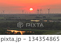 Colorful Sunset with Wind Turbines in the Netherlands. Sustainability, Modern and Renewable energy. Red Sky Aerial Shot. 134354865