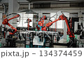Industrial Robotic Arms Work In Harmony To Weld And Assemble Various Metal Pieces Seamlessly 134374459